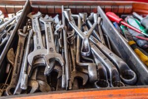 This is a picture of several compartments filled to the top with a variety of silver tools, such a wrenches. Just like a carpenter needs to keep all his tools in a toolbox, I need to keep my mental health "tools" all together in one place.