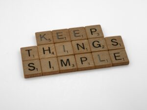 This is a picture of Scrabble tiles that spell out Keep Things Simple against a white background. I have learned I need to keep my transition from summer simple and give myself grace.